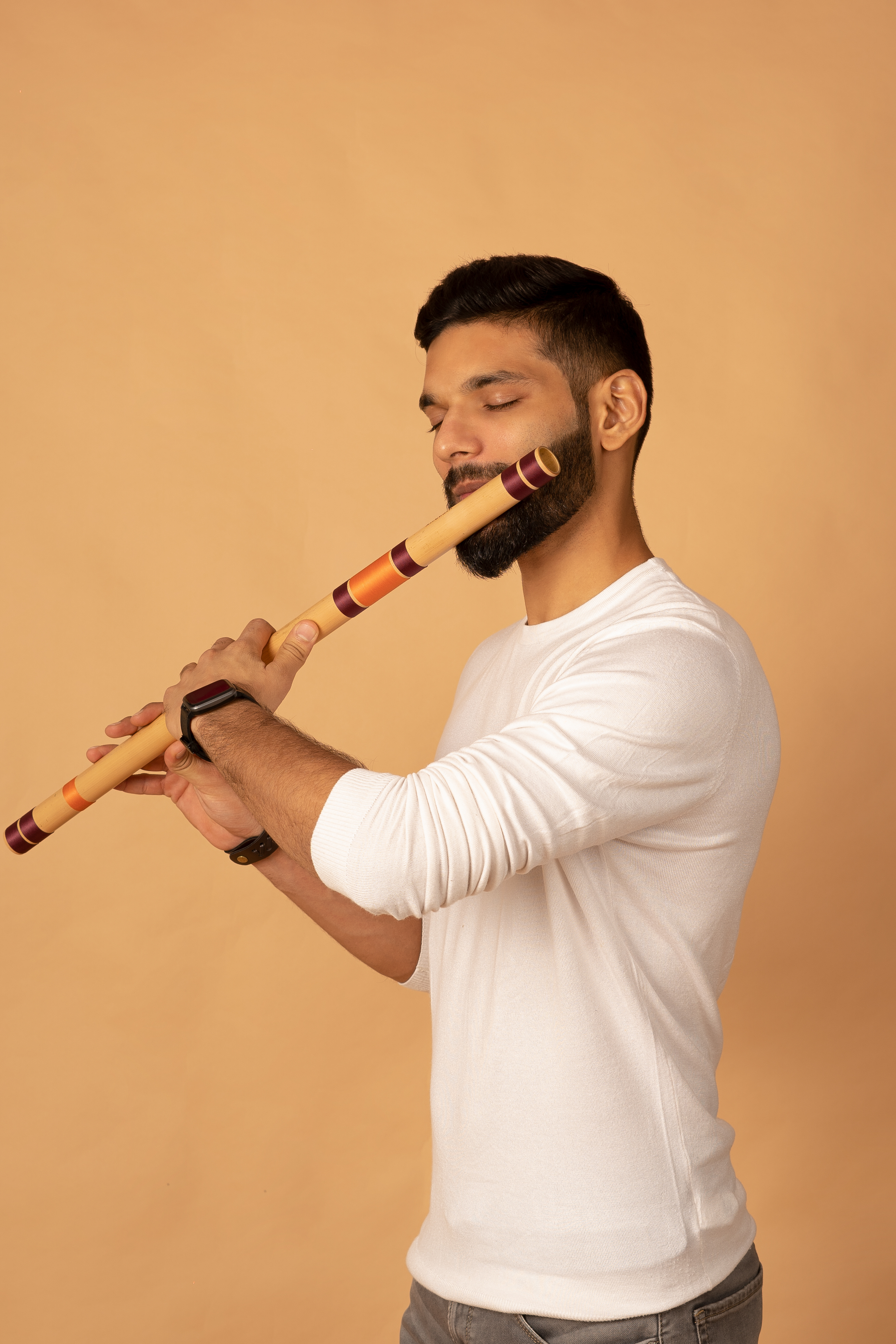 Varsh playing a flute